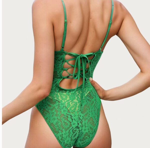 A woman in green bathing suit with lace back.